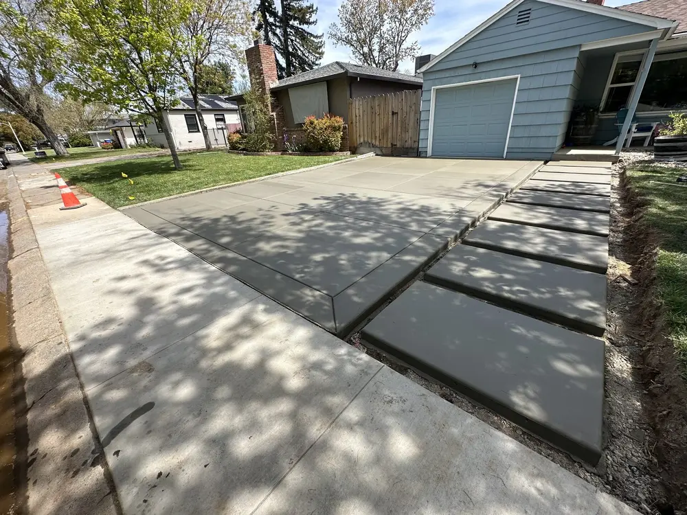 Completed concrete driveway with sidewalk